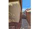 Side yard featuring a walkway and secure gate, with adjacent landscaping at 7317 Caballo Range Ave, Las Vegas, NV 89179