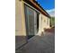 Outdoor living space showcasing access through sliding glass doors to a covered patio and garden at 7317 Caballo Range Ave, Las Vegas, NV 89179
