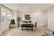 Elegant dining area with a table, modern decor, and natural light at 7717 Rosebark Cliffs St, North Las Vegas, NV 89084