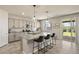 Stylish kitchen with granite counters, stainless appliances, and a seamless transition to outdoor living at 7717 Rosebark Cliffs St, North Las Vegas, NV 89084