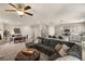 Inviting living room showcasing an open floor plan, modern decor, and stylish furnishings at 7717 Rosebark Cliffs St, North Las Vegas, NV 89084
