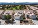 Overhead view of home with well-manicured lawn and landscaping in a golf community at 7921 Fantail Dr, North Las Vegas, NV 89084