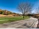 Lush, green common area landscape with walkway provides a serene and inviting experience for residents at 7921 Fantail Dr, North Las Vegas, NV 89084