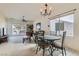 Bright and airy dining area that connects the living room and patio, with a view into the kitchen at 7921 Fantail Dr, North Las Vegas, NV 89084