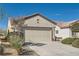 Attractive single-story home with a two-car garage, manicured bushes, and neat landscaping at 7921 Fantail Dr, North Las Vegas, NV 89084