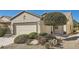 Charming single-story home with a well-manicured desert front yard and two-car garage at 7921 Fantail Dr, North Las Vegas, NV 89084
