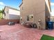 Expansive backyard patio boasting brick pavers, a bench, and string lights, offering a delightful outdoor living space at 8248 Southern Cross Ave, Las Vegas, NV 89131