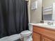 Functional bathroom with a shower-tub combination, single sink vanity and practical amenities at 8248 Southern Cross Ave, Las Vegas, NV 89131