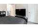 Bedroom featuring neutral walls, dark furniture, and a television with media console at 8248 Southern Cross Ave, Las Vegas, NV 89131