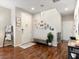 Inviting entryway features wood floors, neutral paint, decorative wall art, and a staircase leading to the upper level at 8248 Southern Cross Ave, Las Vegas, NV 89131