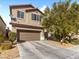 Two-story home featuring a two-car garage, and a well-manicured front yard at 8248 Southern Cross Ave, Las Vegas, NV 89131