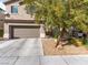 Charming two-story home featuring a two-car garage and manicured front yard at 8248 Southern Cross Ave, Las Vegas, NV 89131