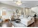 Spacious living room with a large sectional sofa, stylish decor, and hardwood floors, creating an inviting atmosphere at 8248 Southern Cross Ave, Las Vegas, NV 89131