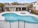 Community pool and jacuzzi surrounded by ample patio space and a covered grilling area at 8248 Southern Cross Ave, Las Vegas, NV 89131
