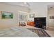 Spacious bedroom featuring a TV and dresser with ample natural light at 8432 Squaw Valley Ave, Las Vegas, NV 89128