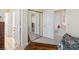 Spacious bedroom featuring mirror sliding door closet and three-door access to other rooms at 8432 Squaw Valley Ave, Las Vegas, NV 89128