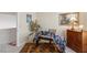 Bright bedroom featuring neutral walls, carpet, and warm-toned antique furniture at 8432 Squaw Valley Ave, Las Vegas, NV 89128