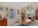 Sunlit dining area featuring large windows and a decorative table at 8432 Squaw Valley Ave, Las Vegas, NV 89128