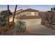 Charming home featuring a three-car garage and landscaped front yard at 8432 Squaw Valley Ave, Las Vegas, NV 89128