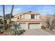 Charming two-story home featuring a tile roof, desert landscaping, and a spacious two-car garage at 8432 Squaw Valley Ave, Las Vegas, NV 89128