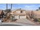Charming two-story home featuring a tile roof, desert landscaping, and a spacious two-car garage at 8432 Squaw Valley Ave, Las Vegas, NV 89128