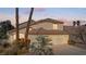 Charming home featuring a three-car garage and landscaped front yard at 8432 Squaw Valley Ave, Las Vegas, NV 89128