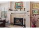Charming fireplace with decorative mantle and tiled surround at 8432 Squaw Valley Ave, Las Vegas, NV 89128