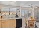 Kitchen featuring a window over the sink and an adjacent dining area with a ceiling fan at 8432 Squaw Valley Ave, Las Vegas, NV 89128
