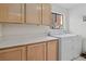 Laundry room with a white countertop and white washer and dryer at 8432 Squaw Valley Ave, Las Vegas, NV 89128