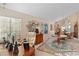 Well-lit living room with a large windows, and hardwood furniture at 8432 Squaw Valley Ave, Las Vegas, NV 89128