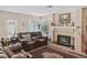 Inviting living room with plush leather seating, fireplace, and elegant decor at 8432 Squaw Valley Ave, Las Vegas, NV 89128
