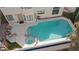 Aerial view showcasing sparkling pool, jacuzzi, and manicured backyard for year-round enjoyment at 8432 Squaw Valley Ave, Las Vegas, NV 89128