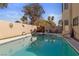 The pool has a hot tub, ladder, and a patio with chairs and a table for lounging at 8432 Squaw Valley Ave, Las Vegas, NV 89128