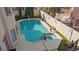 Aerial view of backyard showcasing a sparkling pool, hot tub, and beautifully landscaped yard at 8432 Squaw Valley Ave, Las Vegas, NV 89128