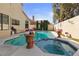 Backyard pool and hot tub with potted plants and manicured landscaping at 8432 Squaw Valley Ave, Las Vegas, NV 89128