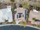 Aerial view of a home with solar panels, tidy landscaping, and a private driveway, in a quiet neighborhood at 10534 Mandarino Ave, Las Vegas, NV 89135