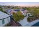 Single-story home with solar panels, lush landscaping, and a private driveway, blending sustainability with style at 10534 Mandarino Ave, Las Vegas, NV 89135
