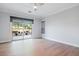 An empty bedroom with wood floors and a sliding glass door to the backyard at 10534 Mandarino Ave, Las Vegas, NV 89135