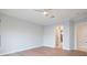 A bedroom with light hardwood floors, base molding and a ceiling fan at 10534 Mandarino Ave, Las Vegas, NV 89135