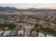 Scenic neighborhood with diverse homes, lush landscaping, and mountain views, creating a serene atmosphere at 10534 Mandarino Ave, Las Vegas, NV 89135