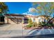 Charming single-story home featuring a well-manicured front yard, two-car garage, and secure gated entry at 10534 Mandarino Ave, Las Vegas, NV 89135