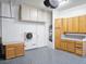 Functional garage features built-in cabinets and countertops for storage and workspace at 10534 Mandarino Ave, Las Vegas, NV 89135