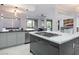 Open-concept kitchen featuring modern design, stainless steel appliances, and an expansive center island at 10534 Mandarino Ave, Las Vegas, NV 89135