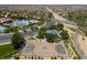 Aerial view of a basketball court, lush landscaping, and a playground inside the community at 1056 Via Panfilo Ave, Henderson, NV 89011