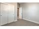 Bedroom featuring carpet, sliding-door closet, neutral walls and white trim at 1056 Via Panfilo Ave, Henderson, NV 89011