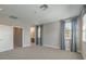 Large bedroom features three windows and a glimpse into an en-suite bath at 1056 Via Panfilo Ave, Henderson, NV 89011