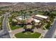 Panoramic aerial showcasing an expansive community center with a large pool and lush landscaping at 1056 Via Panfilo Ave, Henderson, NV 89011