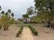 Manicured community green with walkway offers a serene escape near residential homes at 1056 Via Panfilo Ave, Henderson, NV 89011