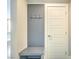 Neat entryway showcasing a storage bench and a door at 1056 Via Panfilo Ave, Henderson, NV 89011