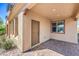 Inviting front porch with brick pavers, a welcome mat, and a well-lit entryway at 1056 Via Panfilo Ave, Henderson, NV 89011